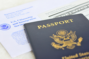 Passport on top of a completed EB-5 Visa application