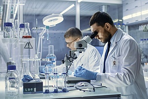 a scientist with an EB-2 visa working in a laboratory