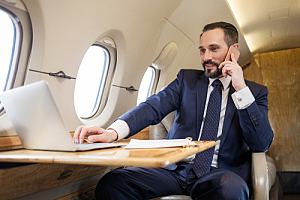 Business executive on plane