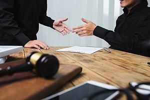 Criminal defense lawyer with client