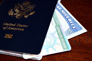 Green card with passport and social security card