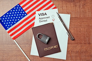 a passport and student visa documents with an american flag