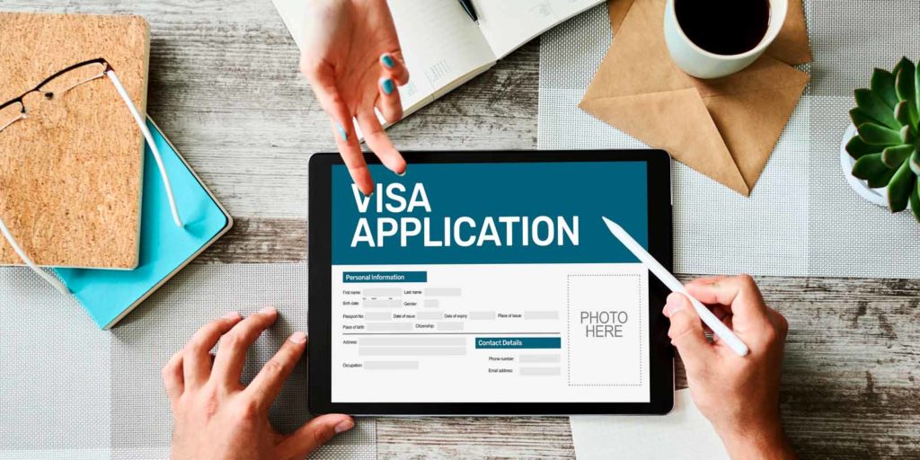 a-person-completing-an-h1-b-visa-application-on-a-tablet