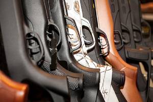 close-up of guns grips.In April of 2020, Virginia Gov. signed Virginia Gun Laws 2020