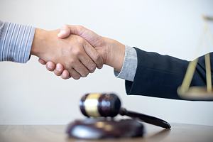 Criminal defense attorney with client 