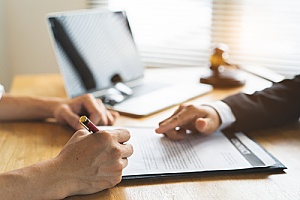 an immigration attorney assisting a client with an immigration waiver