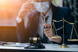 lawyer or judge wearing protective mask on the consult