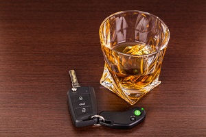 car keys and alcoholic drink owned by someone wondering 