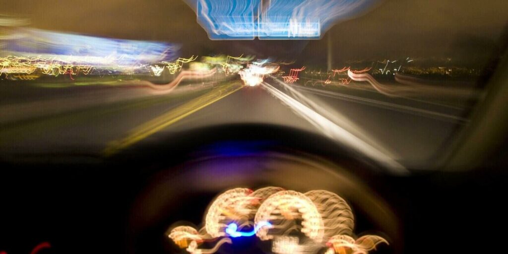 Driver speeding down the highway