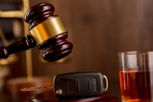 court gavel car key and glass of alcohol saying per se