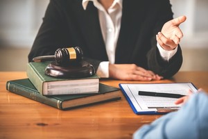 Lawyer talking with his client over the desk